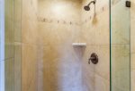 Unwind after a log day at the beach in your custom walk-in shower